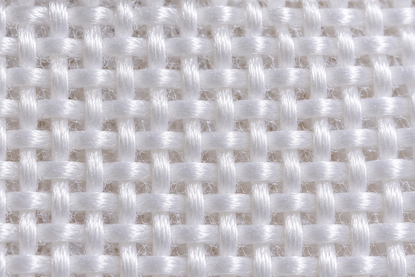 Close-up of a white woven bed sheet fabric